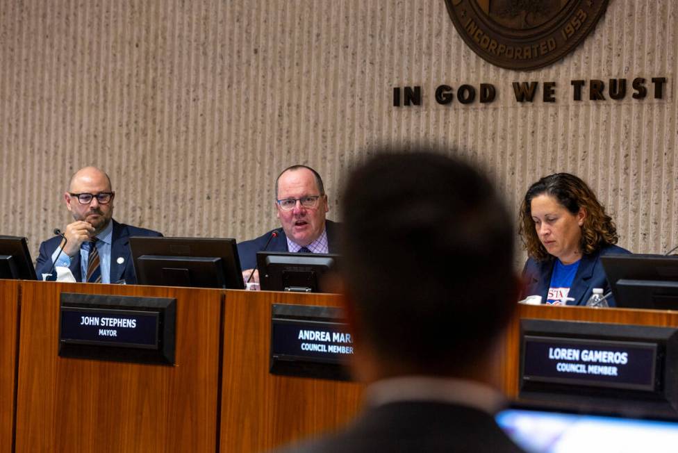 Mayor John Stephens, center, asks a question of Raiders counsel Lucas Paule as the City of Cost ...