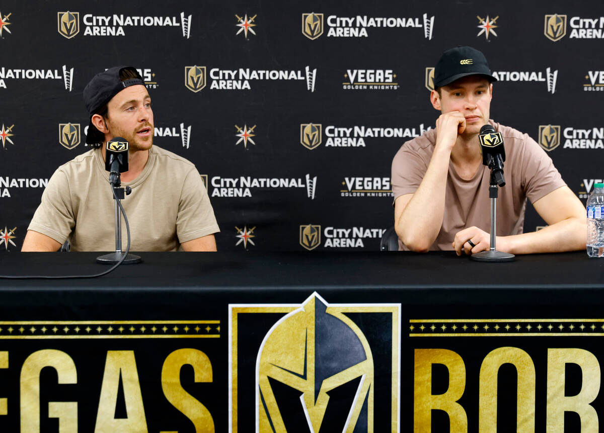 Golden Knights right wing Jonathan Marchessault, left, speaks as defenseman Braydon McNabb look ...