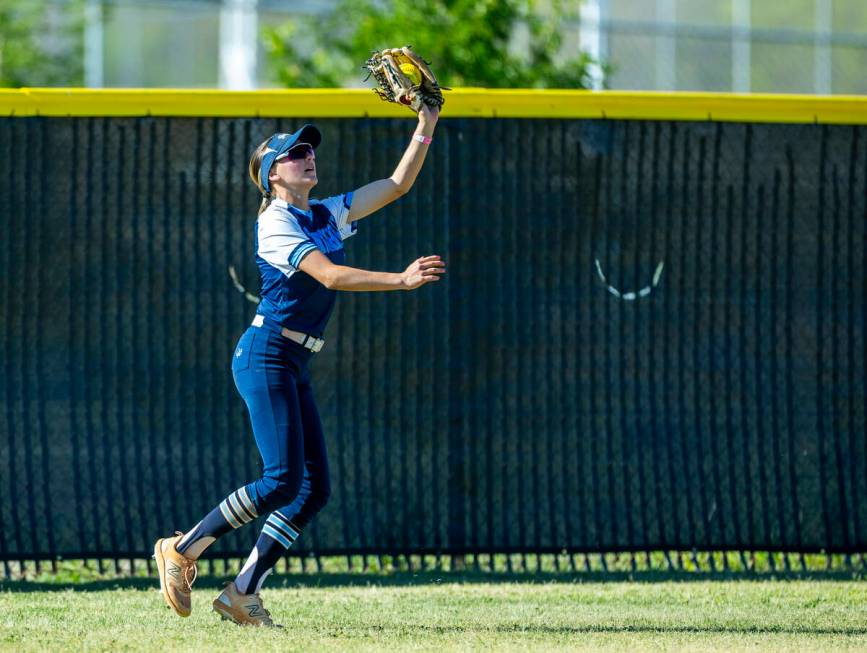 Centennial outfielder Ashley Madonia (3) grabs a long fly ball from a Palo Verde batter during ...