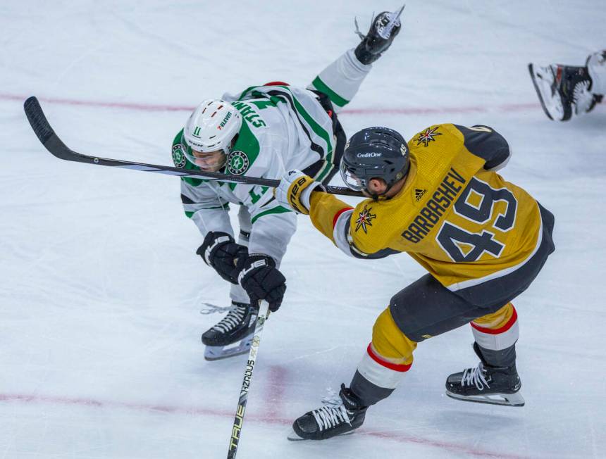 Golden Knights center Ivan Barbashev (49) catches Dallas Stars center Logan Stankoven (11) in t ...