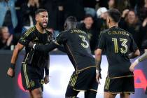 Los Angeles FC forward Denis Bouanga, left, celebrates his goal against the Portland Timbers wi ...