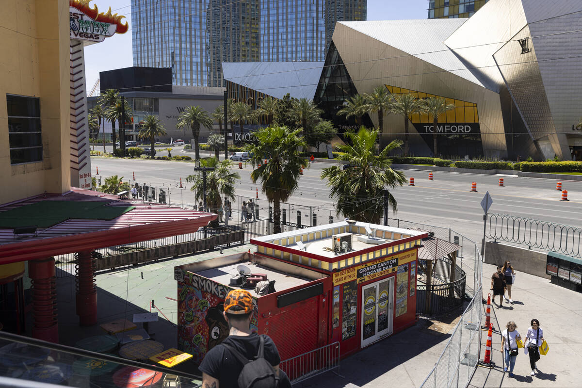 People walk by the site of a planned casino-resort, owned by billionaire Tilman Fertitta, on th ...