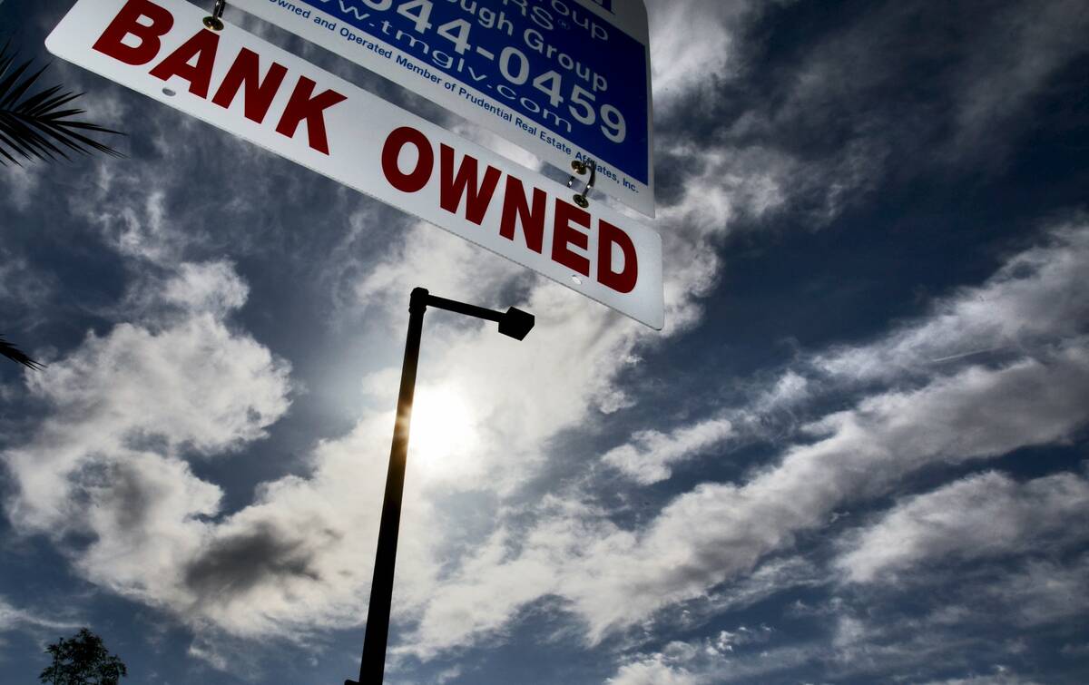 A realtor sign gives notice that a home for sale in the Summerlin area is "Bank Owned" Wednesda ...