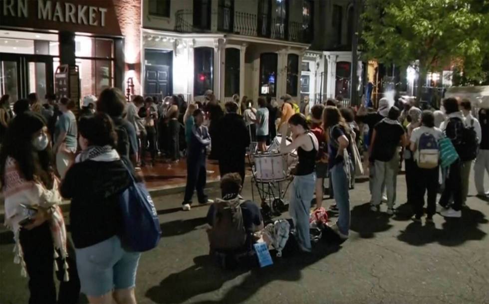 In this grab taken from video, protestors protesting the Israel-Hamas war stand outside near th ...