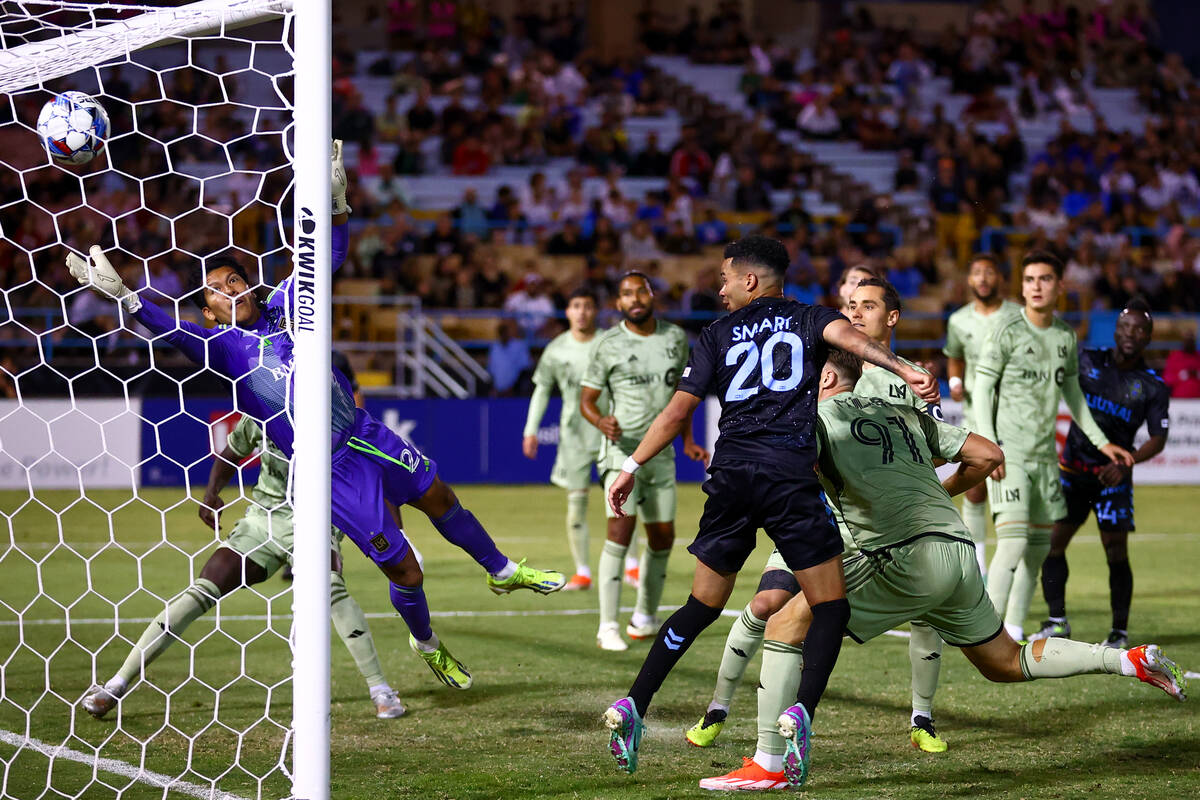 Las Vegas Lights FC defender Shawn Smart (20) scores a goal on Los Angeles FC goalkeeper Abraha ...