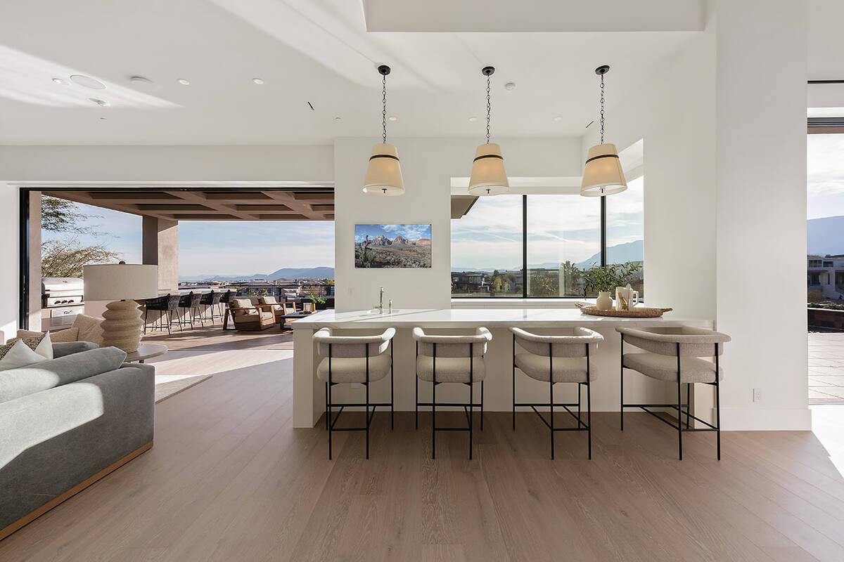 The Summerlin home features a chef’s kitchen, equipped with state-of-the-art appliances and f ...