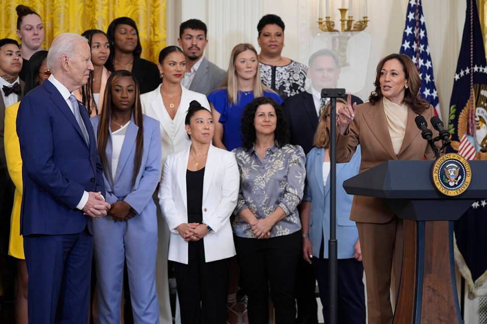 Vice President Kamala Harris speaks as President Joe Biden, left, listens during an event to ce ...