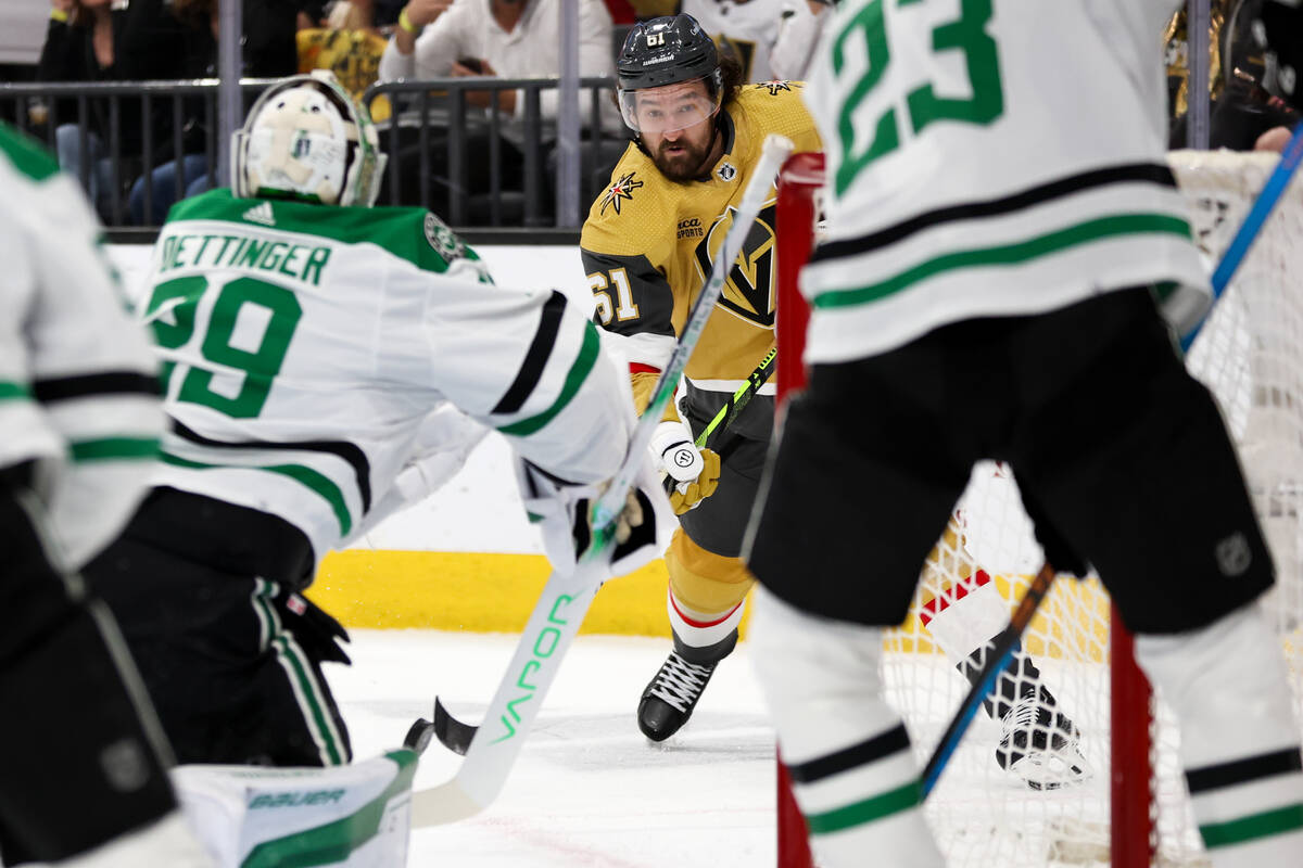 Golden Knights right wing Mark Stone (61) shoots on Stars goaltender Jake Oettinger (29) during ...