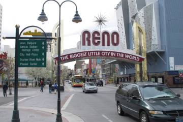 FILE - Pedestrians and traffic on Virginia Street on Thursday, March 27, 2014, in downtown Reno ...