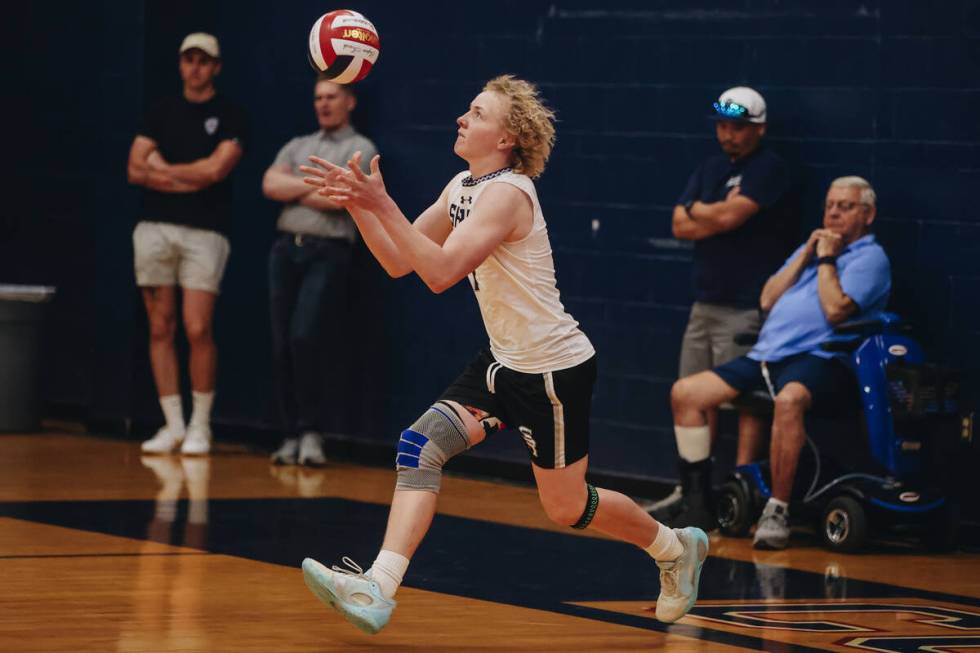 Shadow Ridge setter Trevor Grondahl (1) sets the ball during a Class 5A high school boys volley ...