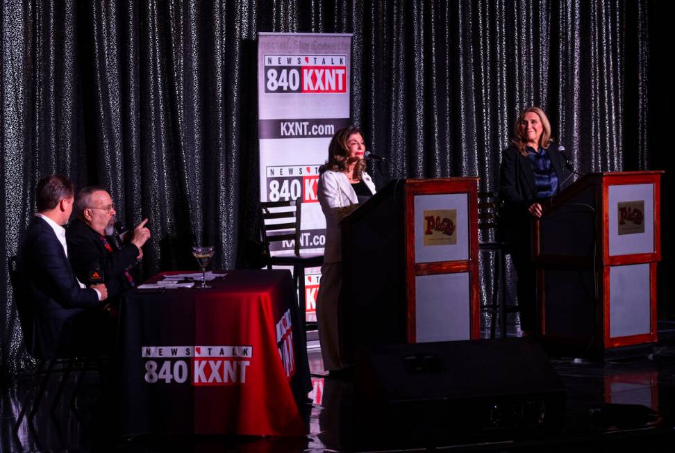 Moderator Alan Stock, second from left, introduces former U.S. Rep. Shelley Berkley, center, an ...