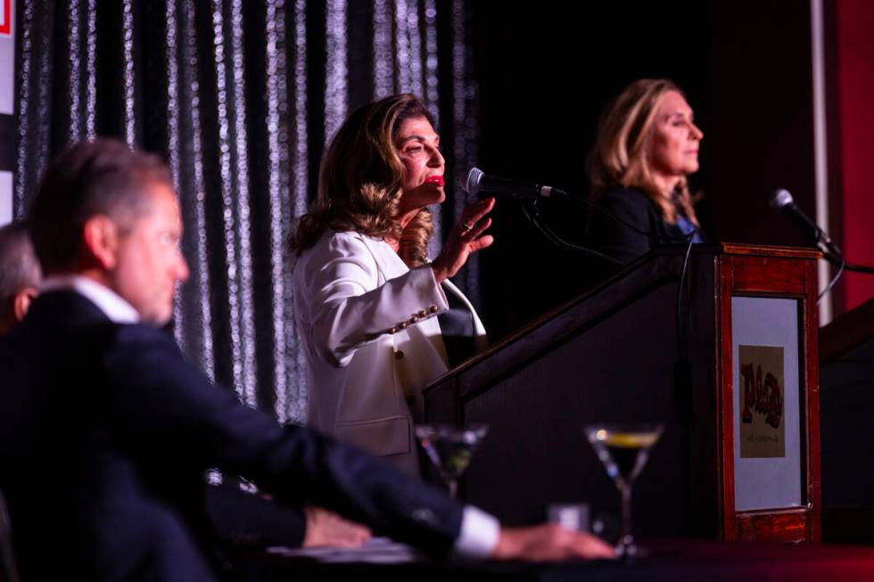 Former U.S. Rep. Shelley Berkley, left, speaks alongside Councilwoman Victoria Seaman, right, ...