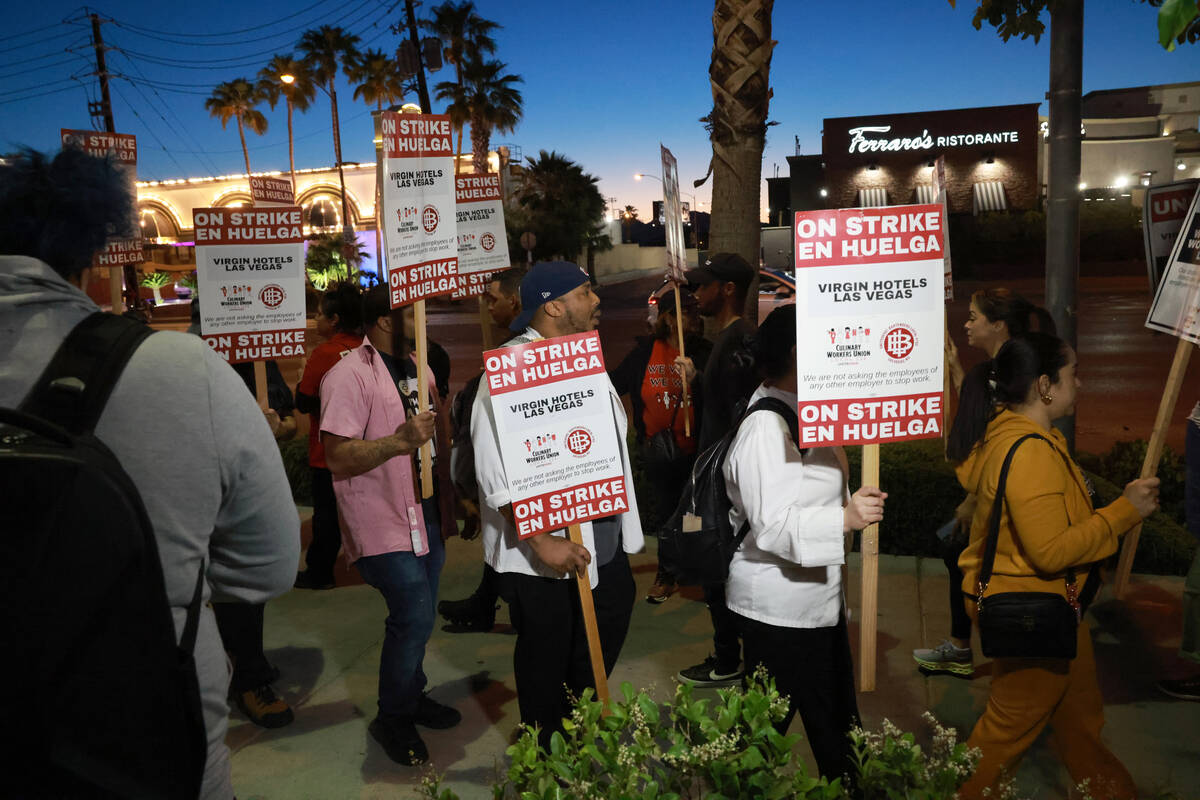 Culinary Local 226 members walk the picket lines just after 5 a.m. at the start of a 48 hour st ...