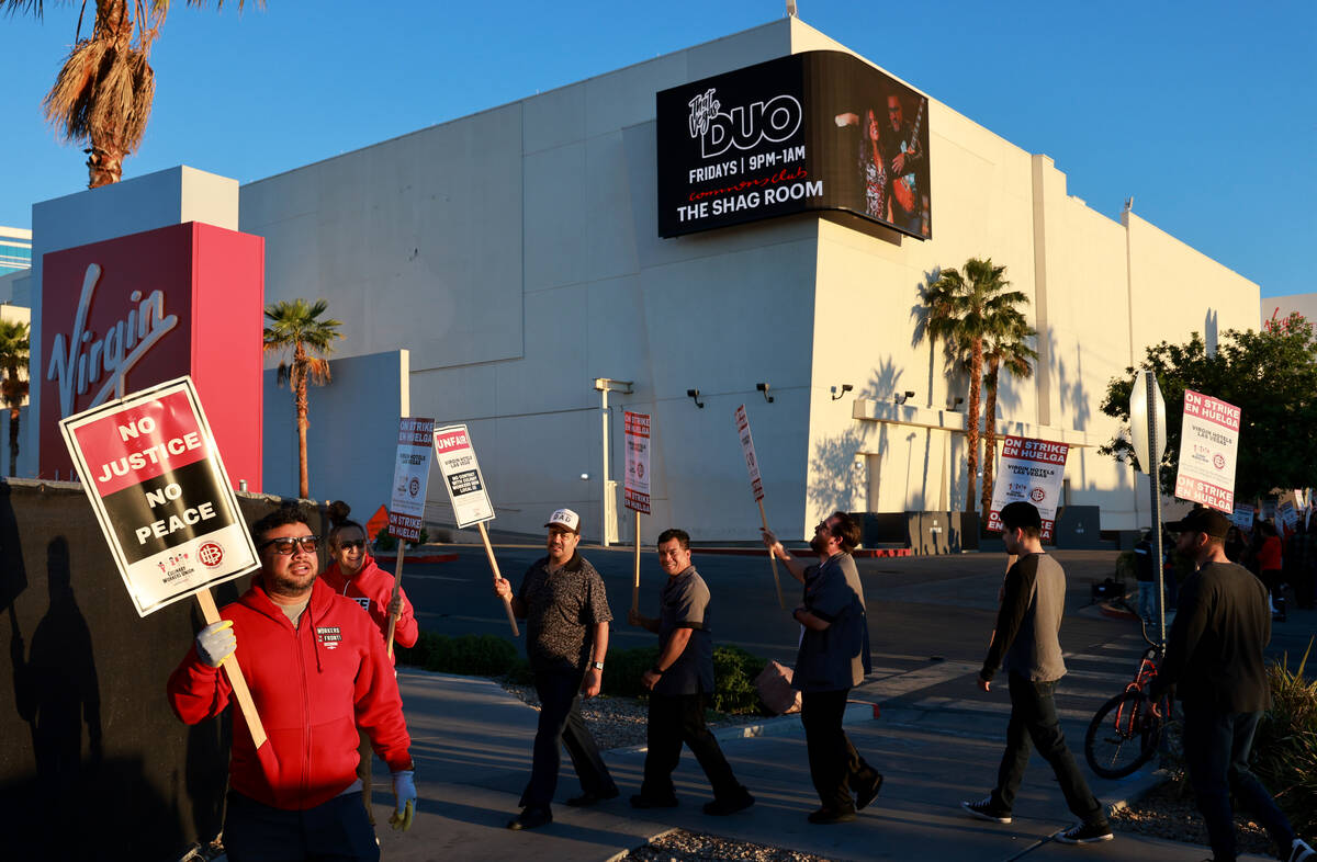 Culinary Local 226 members walk the picket line at the start of a 48 hour strike at Virgin Hote ...