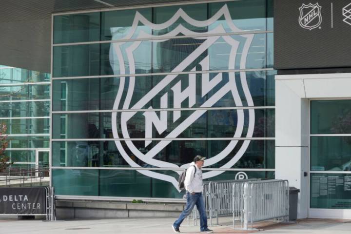 A sign celebrating the awarding of a new NHL team to Utah is shown at the Delta Center Friday, ...