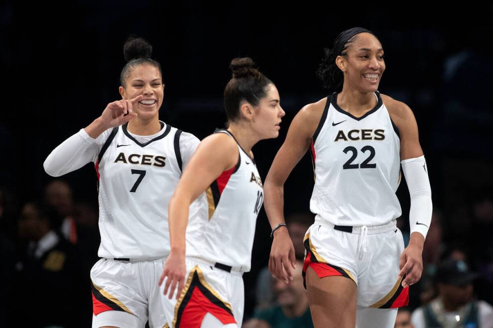 Las Vegas Aces forward Alysha Clark (7), guard Kelsey Plum (10) and forward A'ja Wilson (22) ce ...