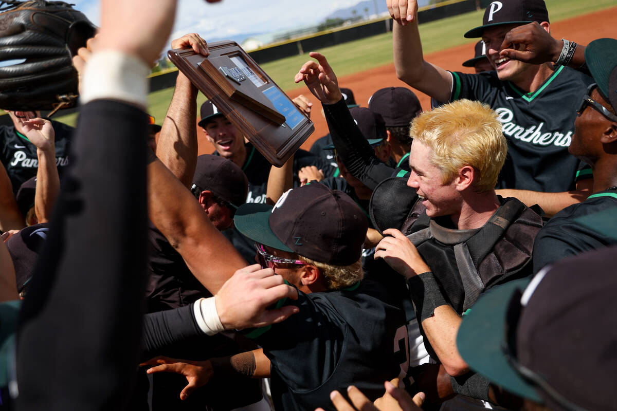 Palo Verde celebrates with their plaque after winning a Class 5A high school baseball Southern ...