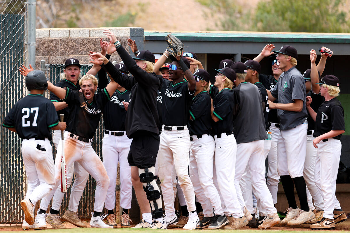 Palo Verde welcomes infielder Barrett Johnson (27) into the dugout after he scored during a Cla ...