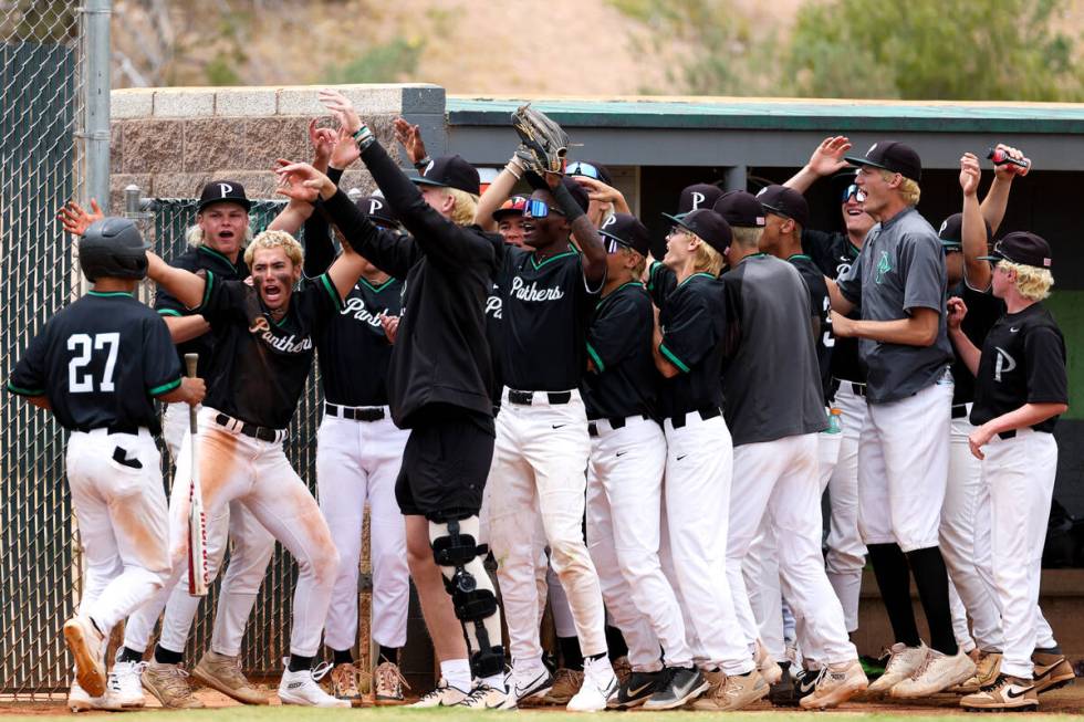 Palo Verde welcomes infielder Barrett Johnson (27) into the dugout after he scored during a Cla ...