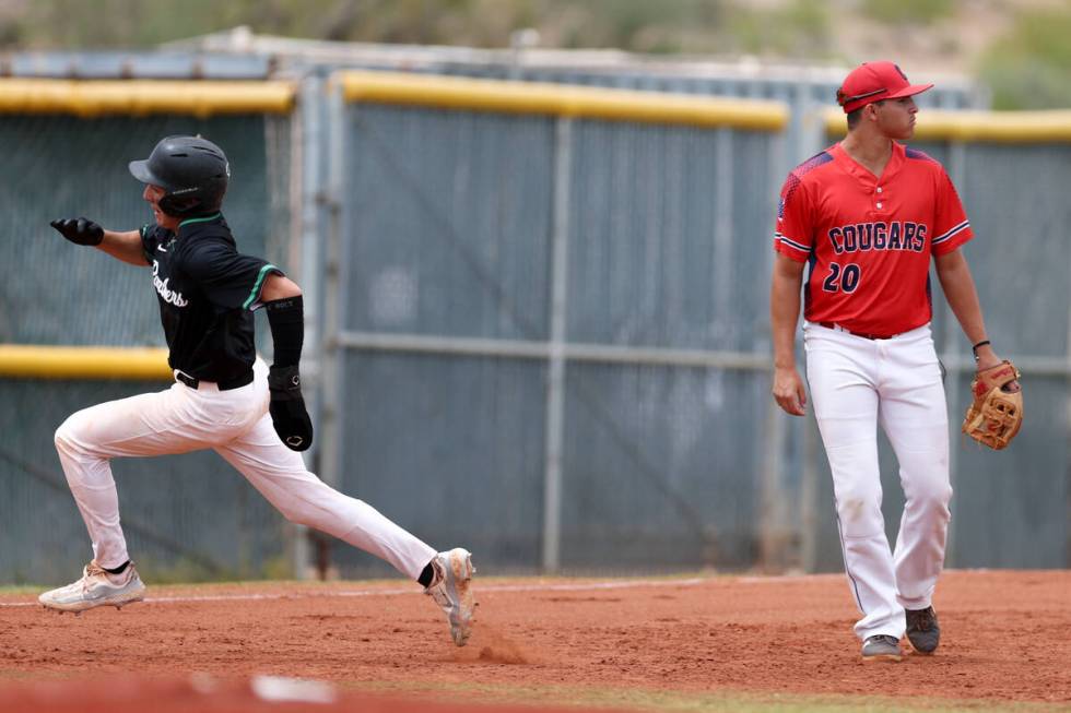 Palo Verde’s Karsen Smaka (6) rounds third base while Coronado third baseman Jase Pashal ...