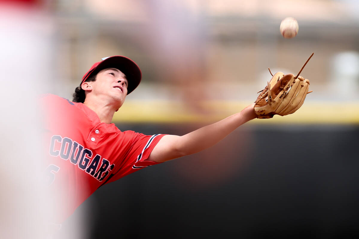 Coronado infielder Louis Dion reaches to catch for an out on Palo Verde during a Class 5A high ...