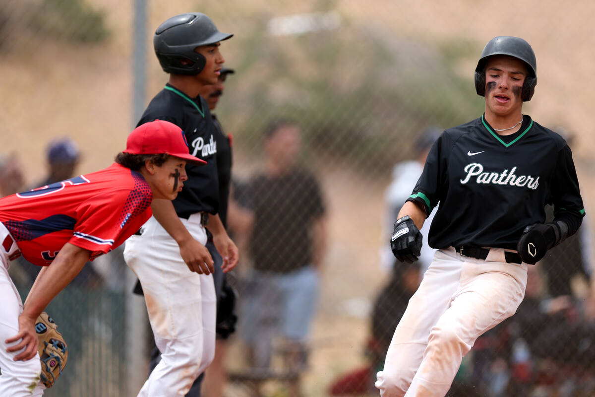 Palo Verde’s Karsen Smaka, right, scores at home plate while Coronado pitcher Sean Cole, ...