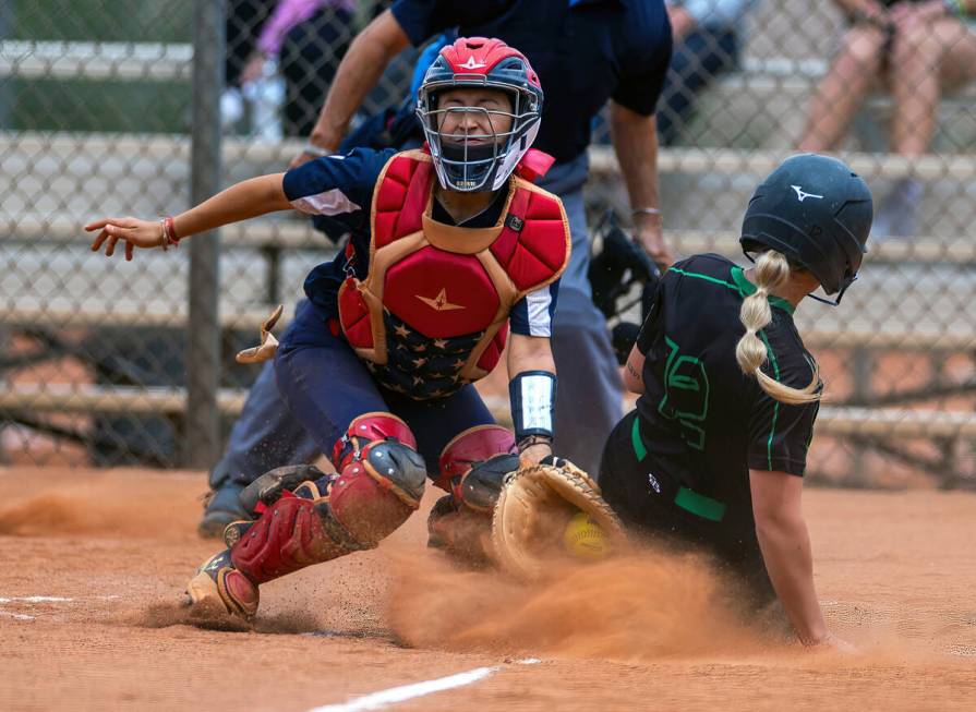 Coronado catcher Caleigh Burns (4) receives the throw home late as Palo Verde runner Paige Bran ...