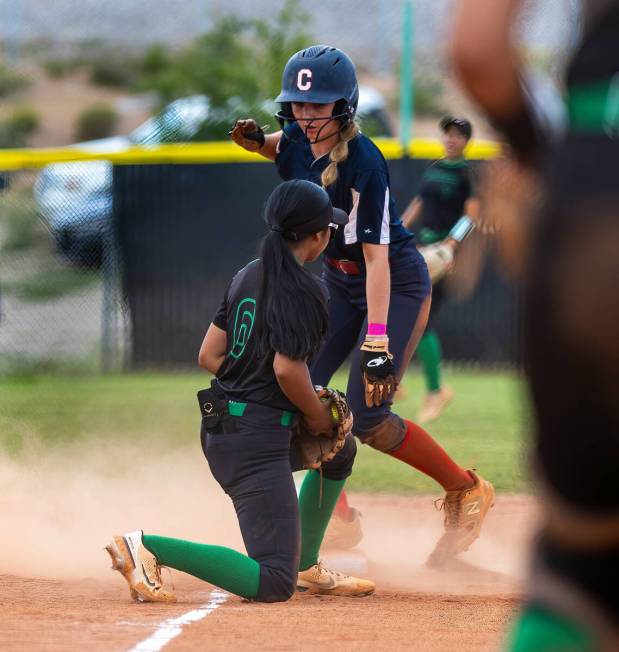 Coronado runner (10) beats a throw to third base for Palo Verde infielder Kayleen Enriquez (6) ...