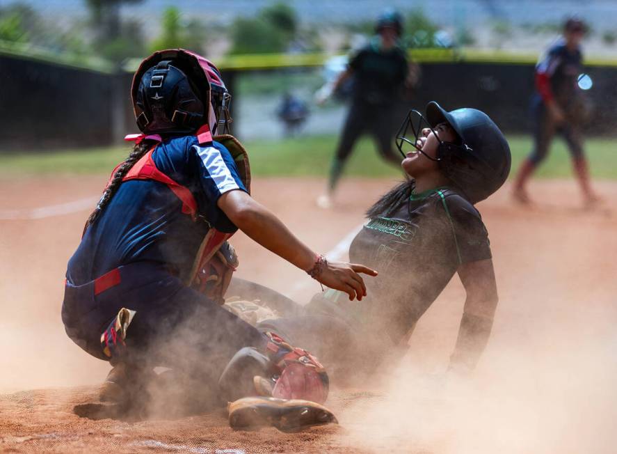 Palo Verde runner Makayla Enriquez (17) yells out after sliding into home safely against Corona ...