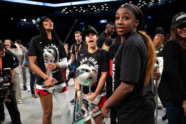 Las Vegas Aces forward A'ja Wilson (22), guard Kelsey Plum (10) and guard Jackie Young celebrat ...