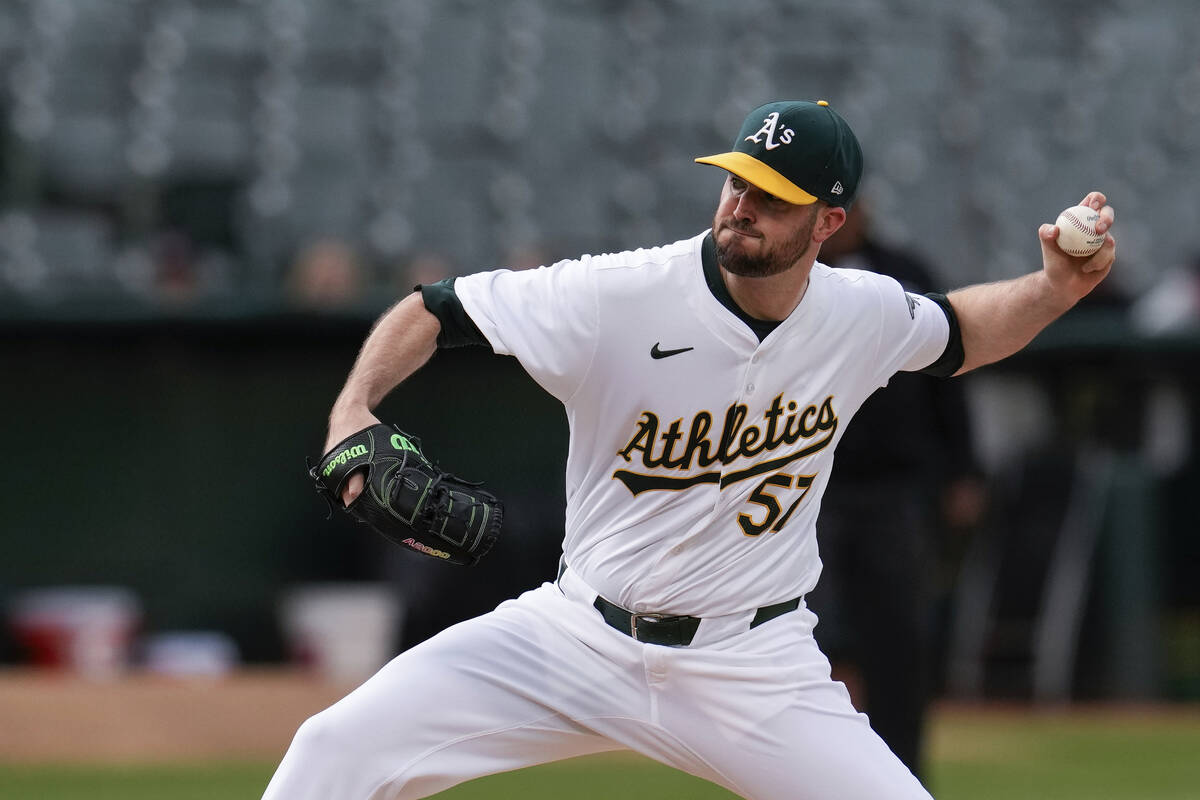 Oakland Athletics pitcher Alex Wood throws to a Texas Rangers batter during the first inning of ...