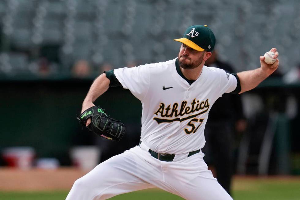 Oakland Athletics pitcher Alex Wood throws to a Texas Rangers batter during the first inning of ...