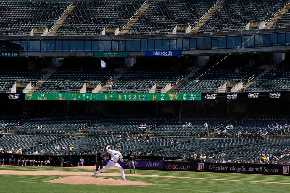 Oakland Athletics pitcher Ross Stripling, bottom, works against the Pittsburgh Pirates during t ...