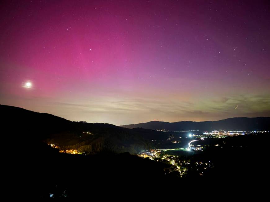 Northern lights appear over the Dreisamtal valley in the Black Forest near Freiburg, Germany, F ...