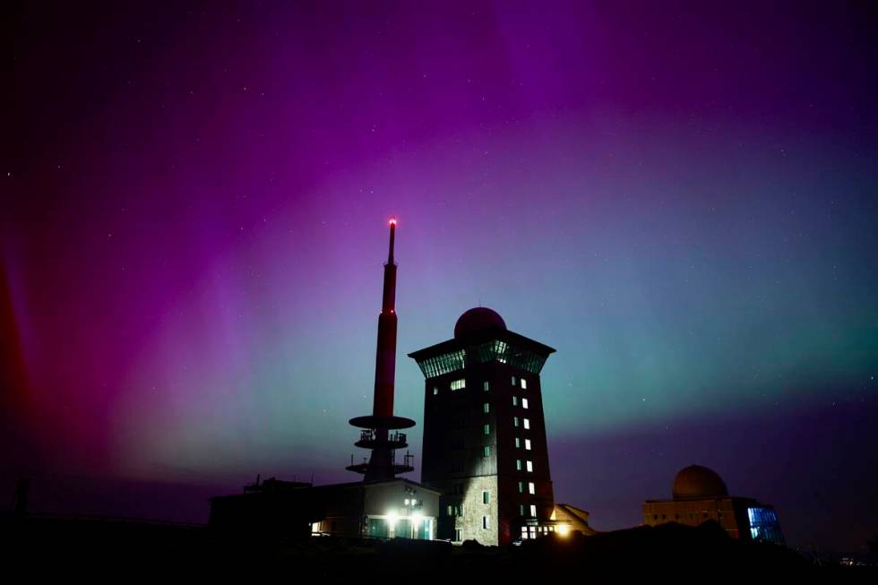 Northern lights appear in the night sky above the Brocken early Saturday, May 11, 2024, in Schi ...