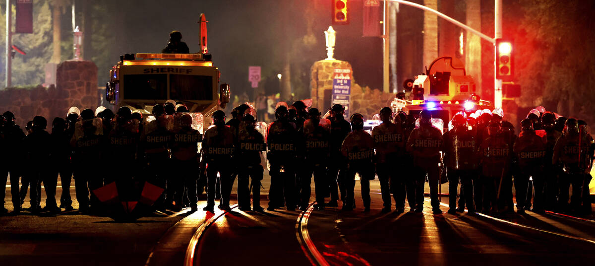 Several area law enforcement agencies stand at the intersection of University Boulevard and Par ...