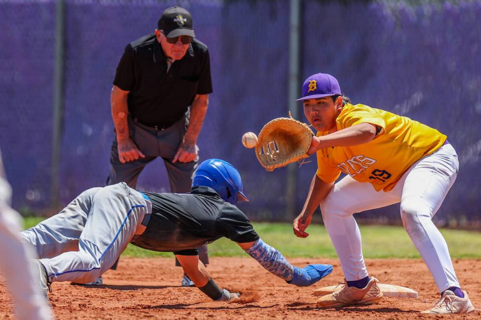 Sierra Vista’s Alex Guevara (8) slides safely while Durango first baseman Luke DeSoto (1 ...