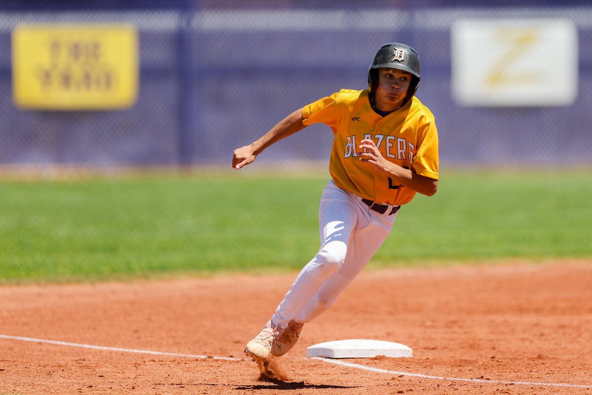 Durango’s Jaylen Bosque (26) rounds first base before scoring during a Class 4A high sch ...