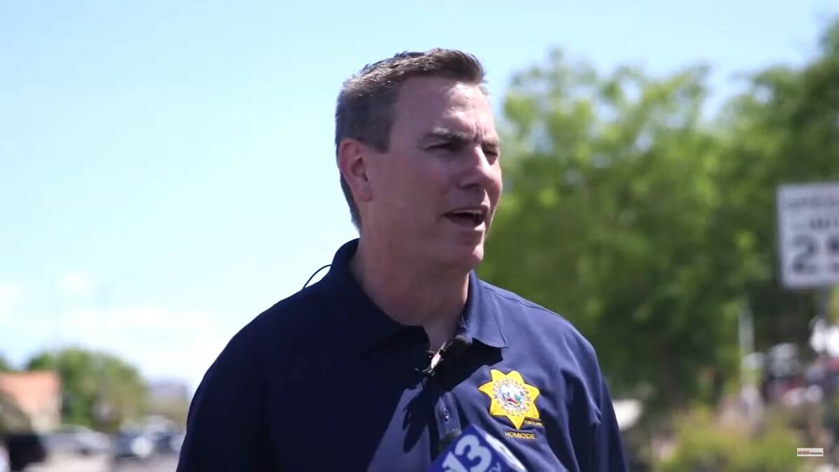 Lt. Jason Johansson, of the Metropolitan Police Department's Homicide Section, briefs reporters ...