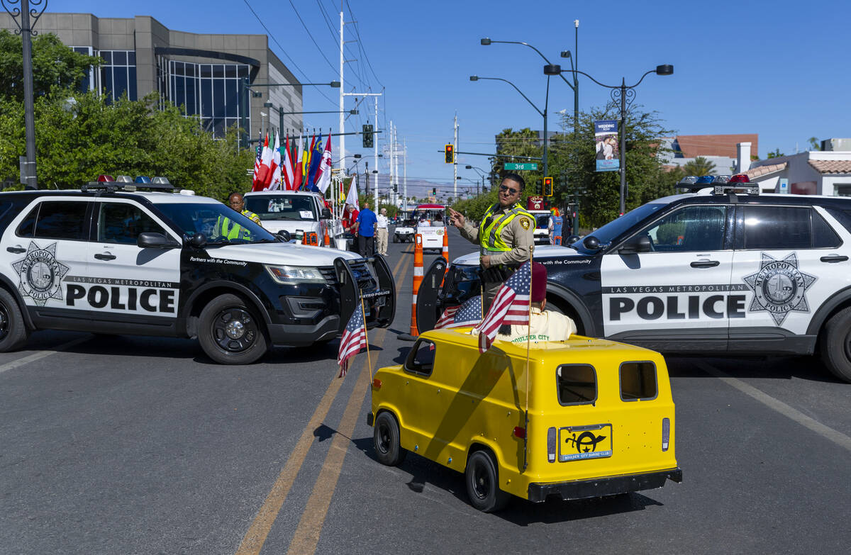 A Zelzah Shriner is directed to his staging area by a Metro officer during the Helldorado Parad ...