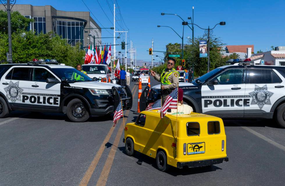 A Zelzah Shriner is directed to his staging area by a Metro officer during the Helldorado Parad ...