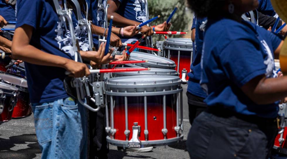 Band members with the Robert O. Gibson Leadership Academy perform for the crowd along the route ...