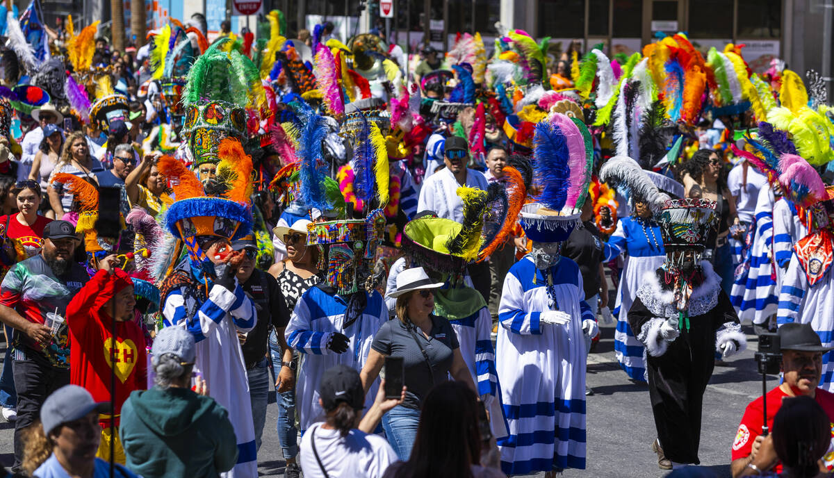 Members of the Banda de Tlayacapan dance and entertain the crowd along the route during the Hel ...