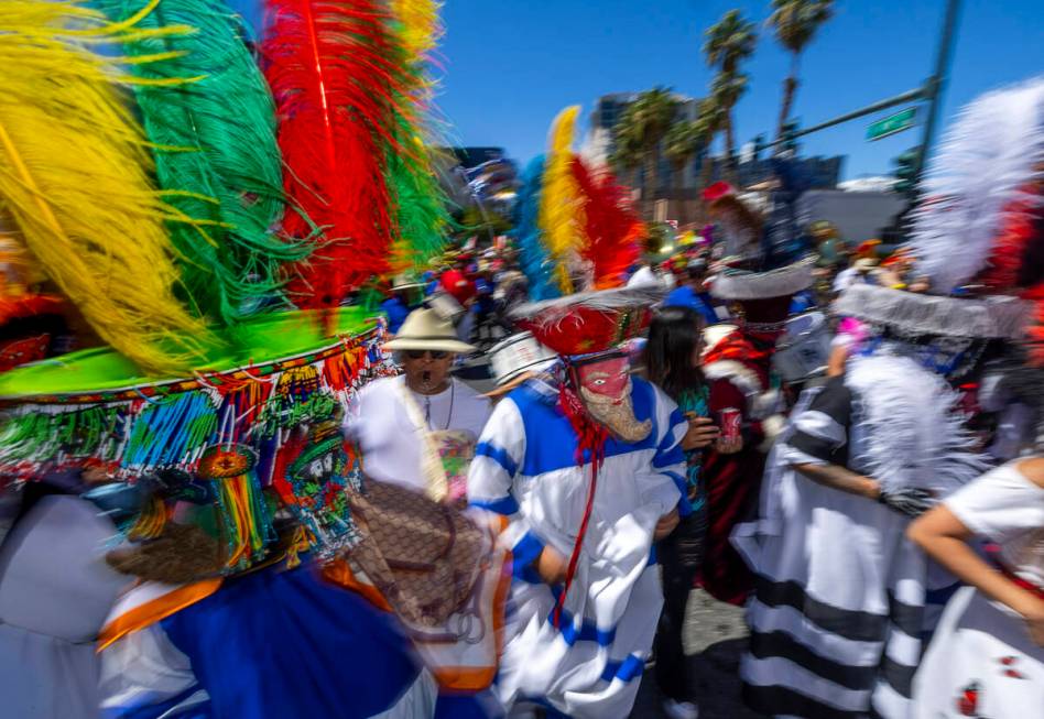 Members of the Banda de Tlayacapan dance and entertain the crowd along the route during the Hel ...