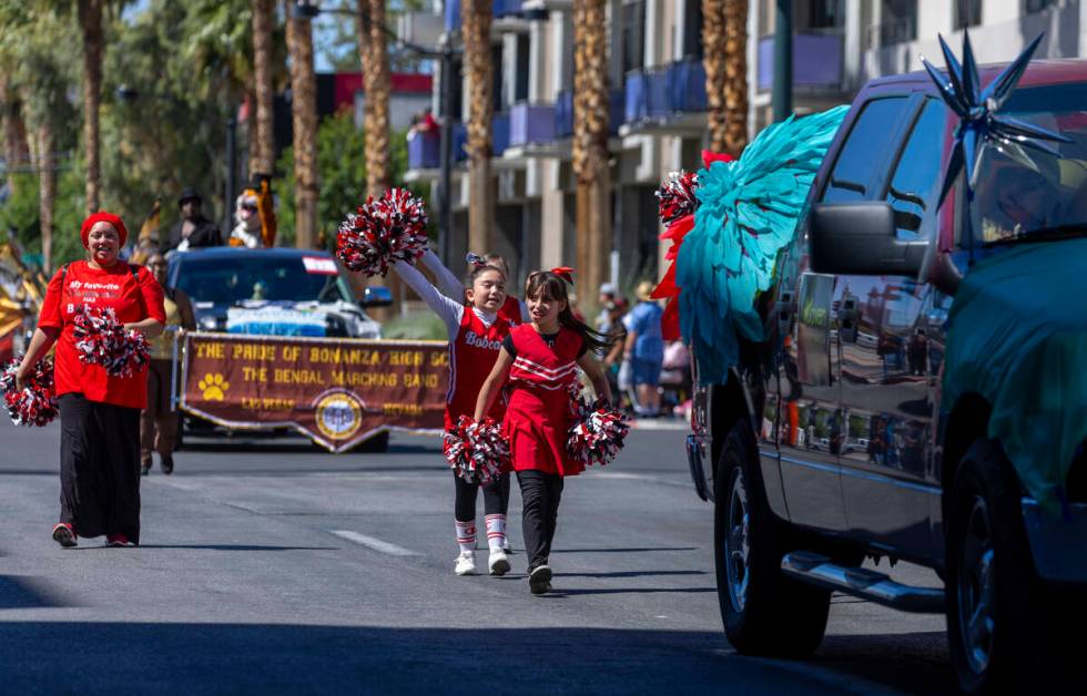 Cheerleads follow a Joven Progresa Foundation vehicle along the route during the Helldorado Par ...