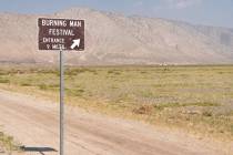 Road signage points the way to the Burning Man festival in the Black Rock Desert in Gerlach, Ne ...