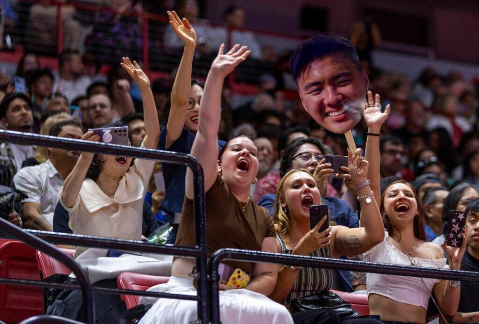 Supporters cheer for a graduate below as he is announced during UNLV spring graduation commence ...