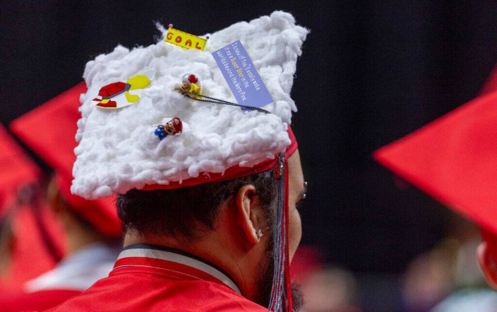 A graduate wears a custom mortar board during UNLV spring graduation commencement exercises at ...