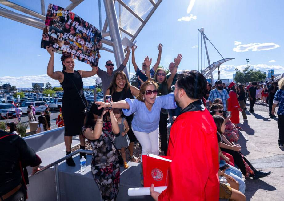 Mom Lani Suarez, with family and friends, congratulate her son Zachary Thelen, 26, after receiv ...