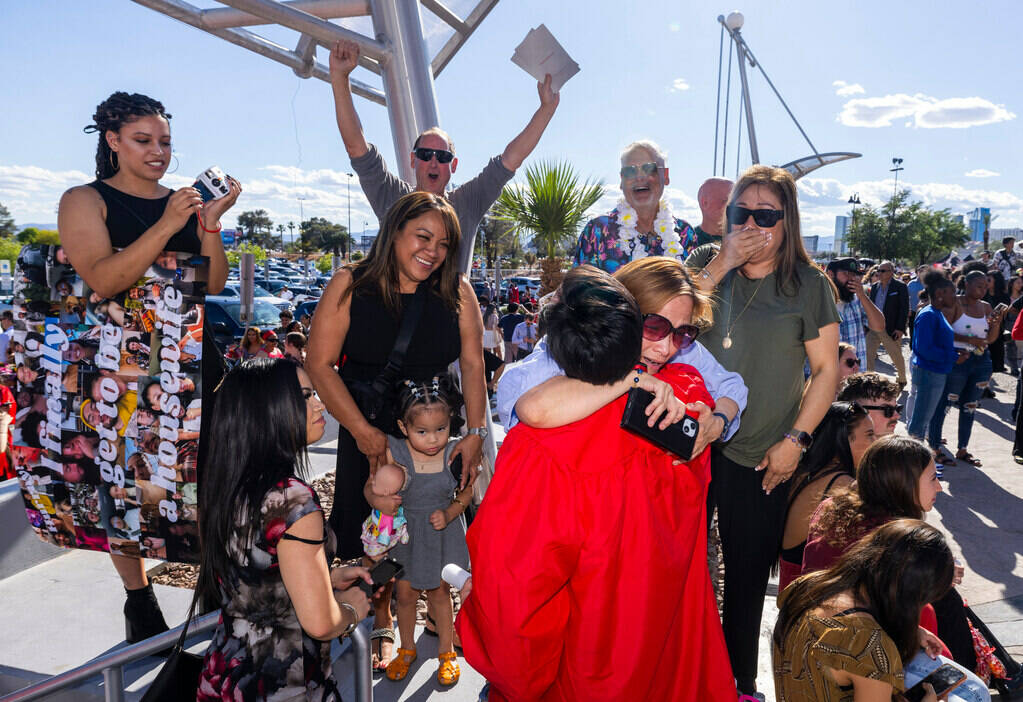 Mom Lani Suarez, with family and friends, congratulate her son Zachary Thelen, 26, after receiv ...